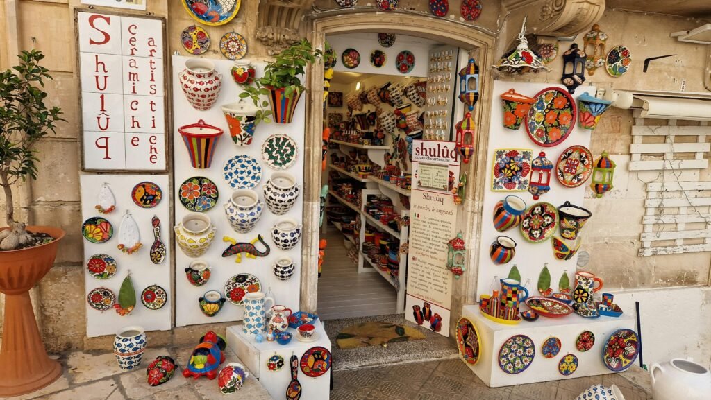 Vibrant display of artistic ceramics at a shop entrance in Ostuni, Włochy.